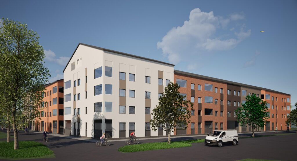 Uusi kerrostalo, jossa valkoinen ja punatiilinen julkisivu, moderni asuinrakennus rauhallisella alueella.